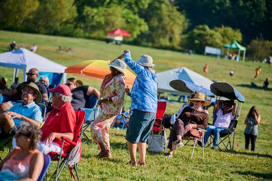 Enjoying a summer afternoon in Howe Meadow at Rhythm on the River.